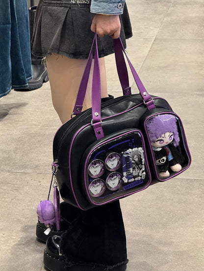 Brotförmige Ita-Umhängetasche in Schwarz und Lila mit Kontrastbesatz