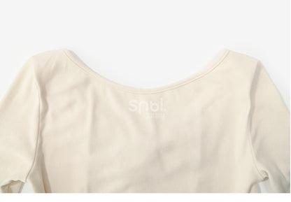 Aprikosenfarbenes, langärmliges Oberteil mit Spitzenbesatz und Schleifendetails