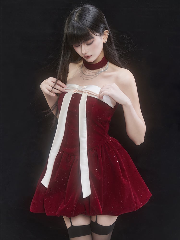 Robe bouffante rouge à épaules dénudées et gros nœud à paillettes