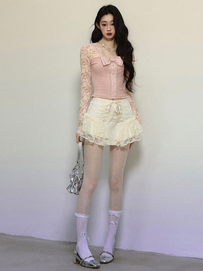 Rosa Stricktop mit Schleifendetails, Spitzenärmeln und V-Ausschnitt