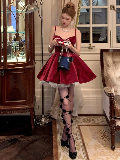 黒/白の水玉模様のポンポン付きタイツ