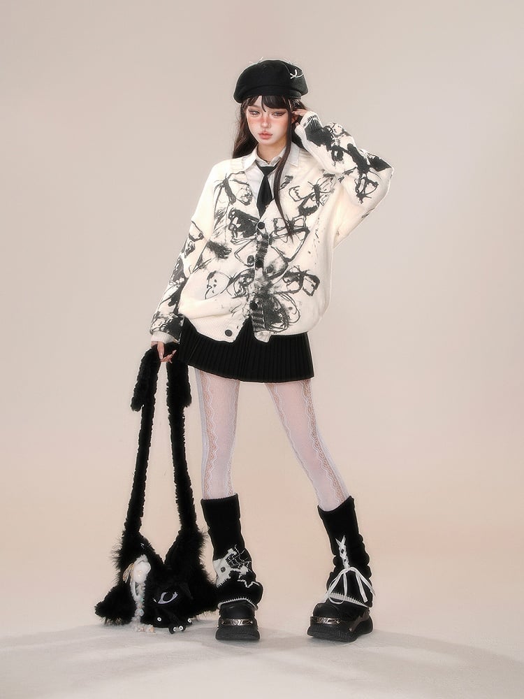 取り外し可能なポンポンとリボン飾りが付いたプリーツスカート