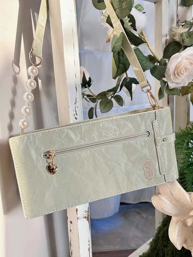 Grünes Cheongsam im Ita-Stil mit Blumenmuster und Fransentasche aus PU mit Schleife