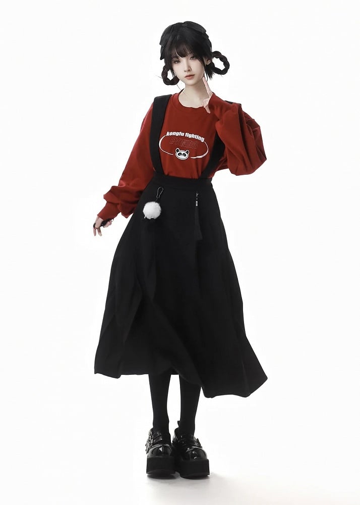 Schwarzer Faltenrock mit abnehmbaren Pompons