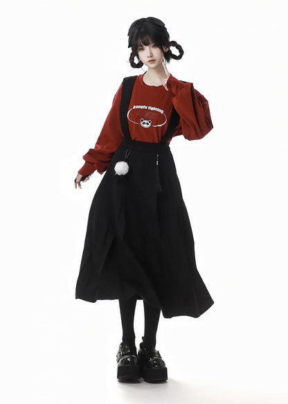 Schwarzer Faltenrock mit abnehmbaren Pompons