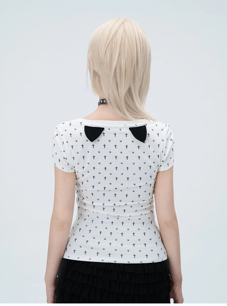 猫の足跡プリント、猫耳ゴシック、背中に白い十字架のディテールTシャツ、オールオーバーパステル