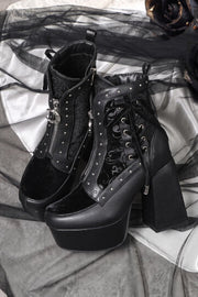 Black platform ankle boots with laced panels