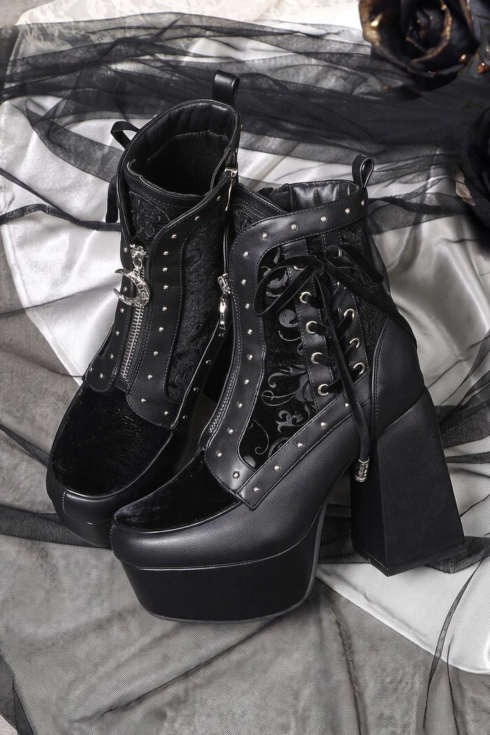Black platform ankle boots with laced panels