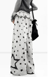 Side view of gray star-print wide-leg trousers