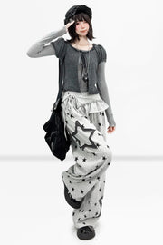 Star trousers styled with a fitted gray top