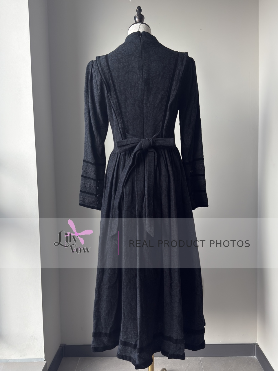 Black Edwardian maid Lolita long-sleeve dress back view with waist tie – LilyVow real product photo