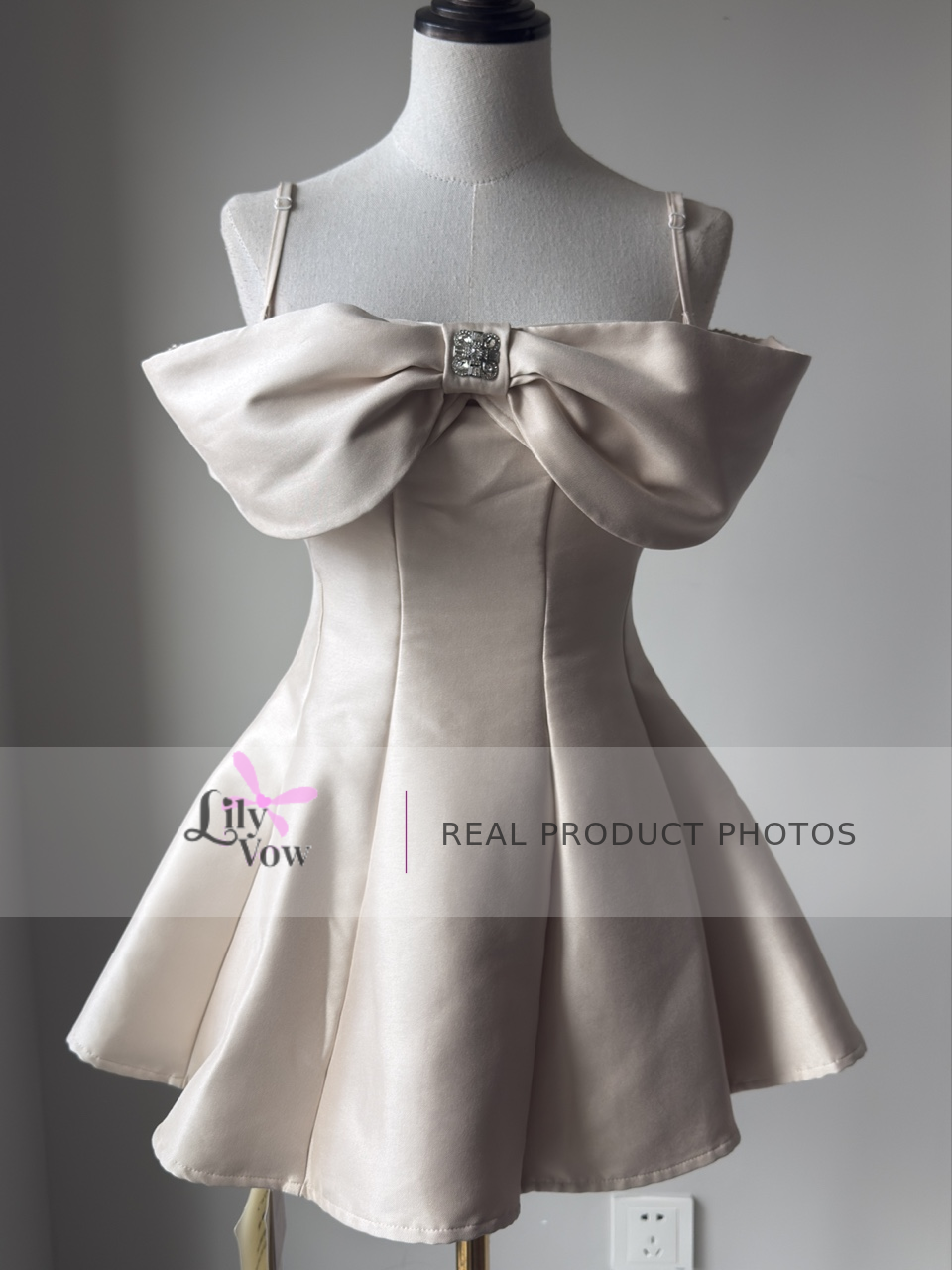 Ivory off-shoulder mini dress with oversized bow front view – LilyVow real product photo