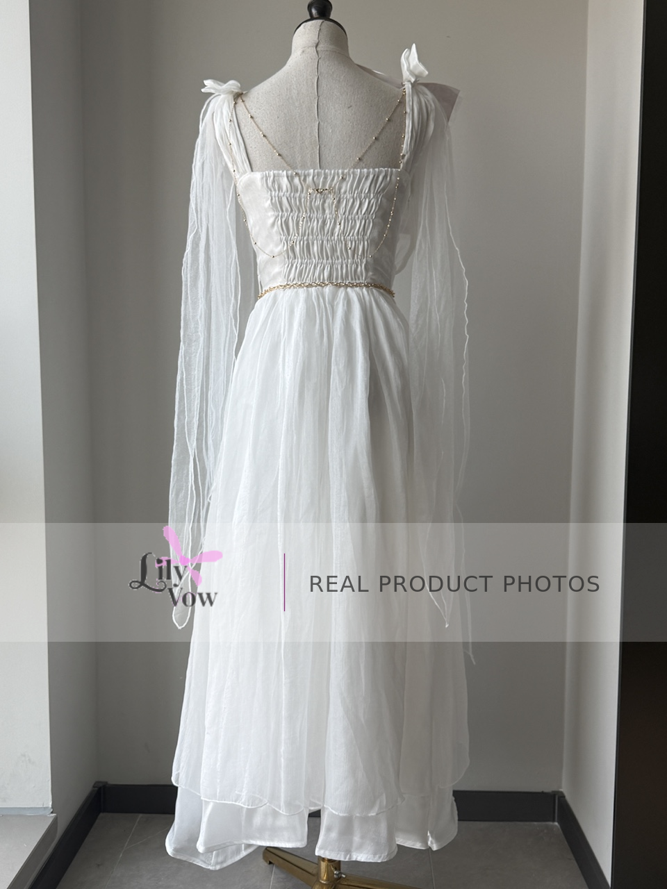 White Greek-inspired maxi dress back view with smocked bodice – LilyVow real product photo