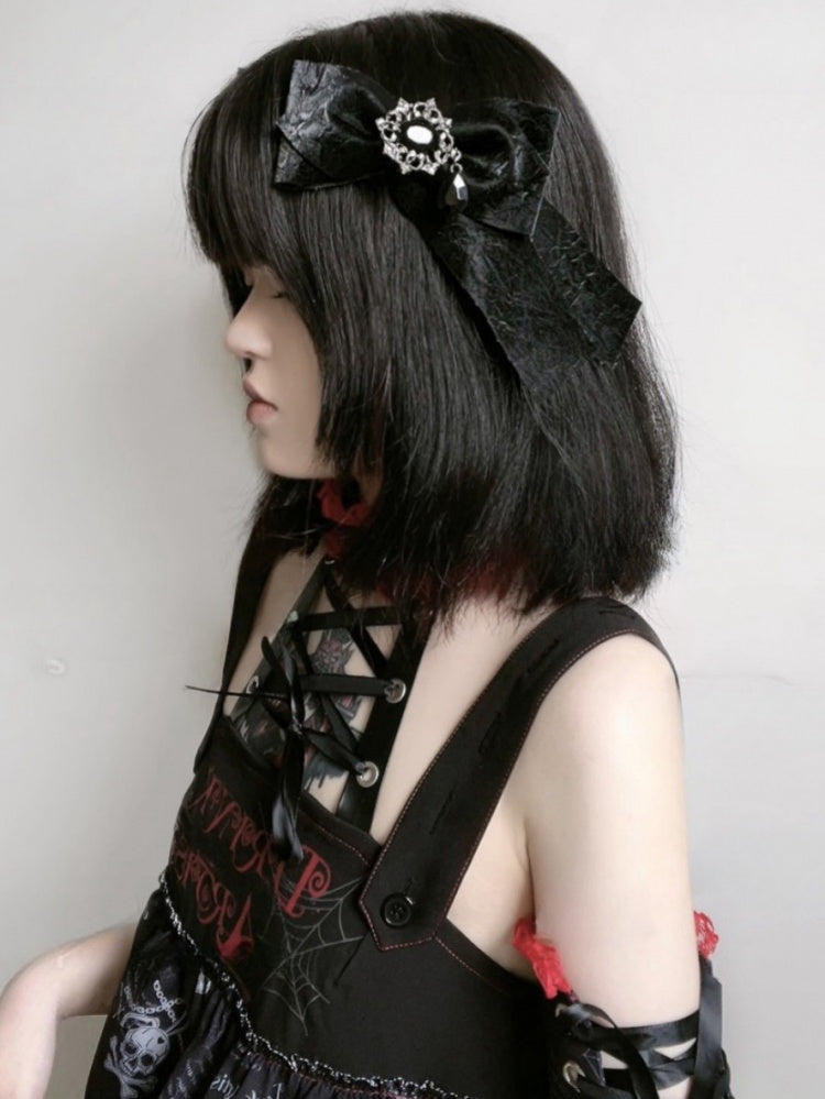 Schwarze Haarspange mit Strasssteinen und Schleife