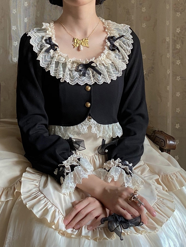 Schwarze, lange, gemütliche Strickjacke mit Schleifenärmeln und Spitzenbesatz, zarten Akzenten und