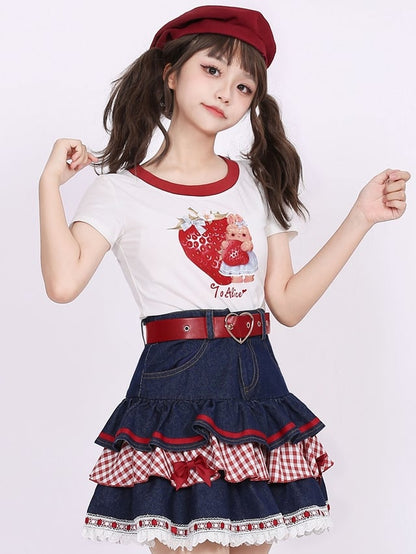 Marineblauer Spitzensaum mit Schleifenakzenten, gestufter Denim-Rock mit kariertem Patchwork