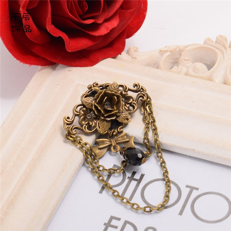 スチームパンクなリボンラインストーンローズブローチ