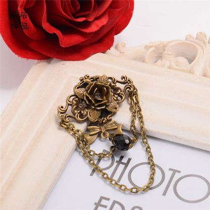 スチームパンクなリボンラインストーンローズブローチ