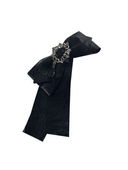 Schwarze Haarspange mit Strasssteinen und Schleife